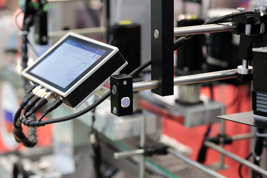 A production line with an HMI touch screen controller