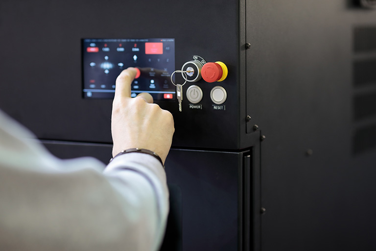 An operator using a touch control panel