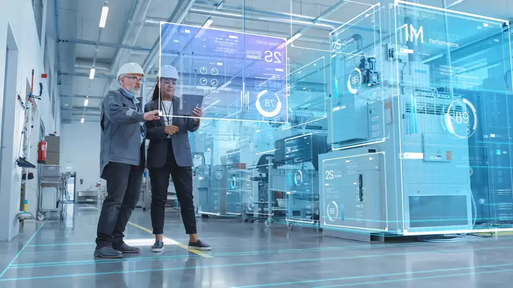 Two engineers looking at a data visualization