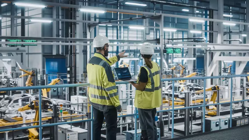 Engineers overseeing an industrial factory