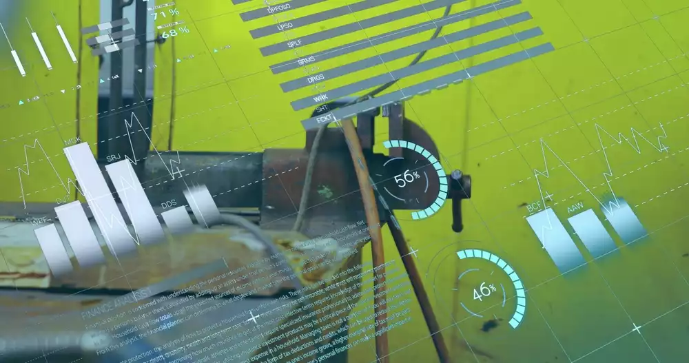 Digital data visualizations overlaying a manufacturing plan,