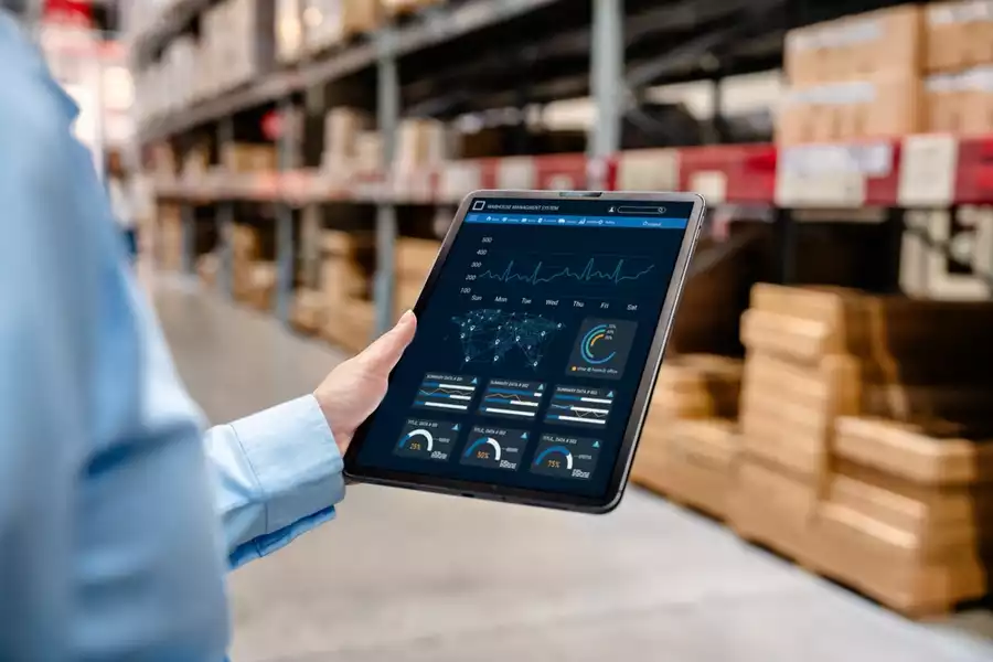 Worker using digital tablet in the warehouse