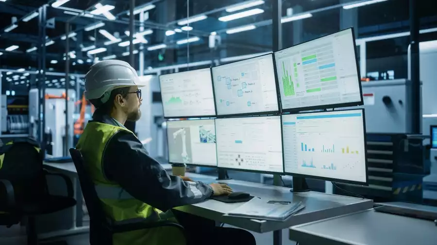 Engineer reviewing manufacturing KPIs