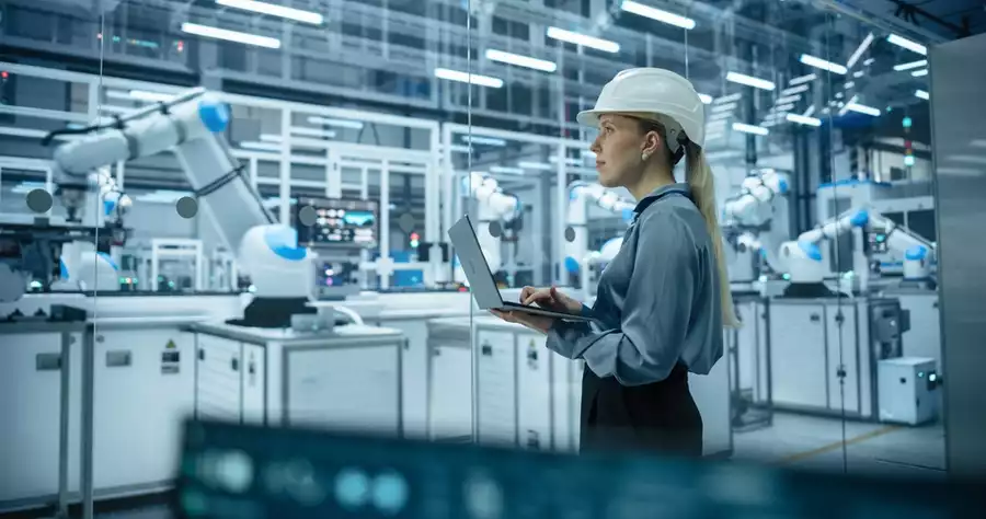 Engineer monitors production line